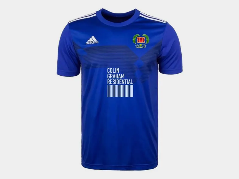 Blue Mossley football shirt with the Colin Graham Residential logo across the chest